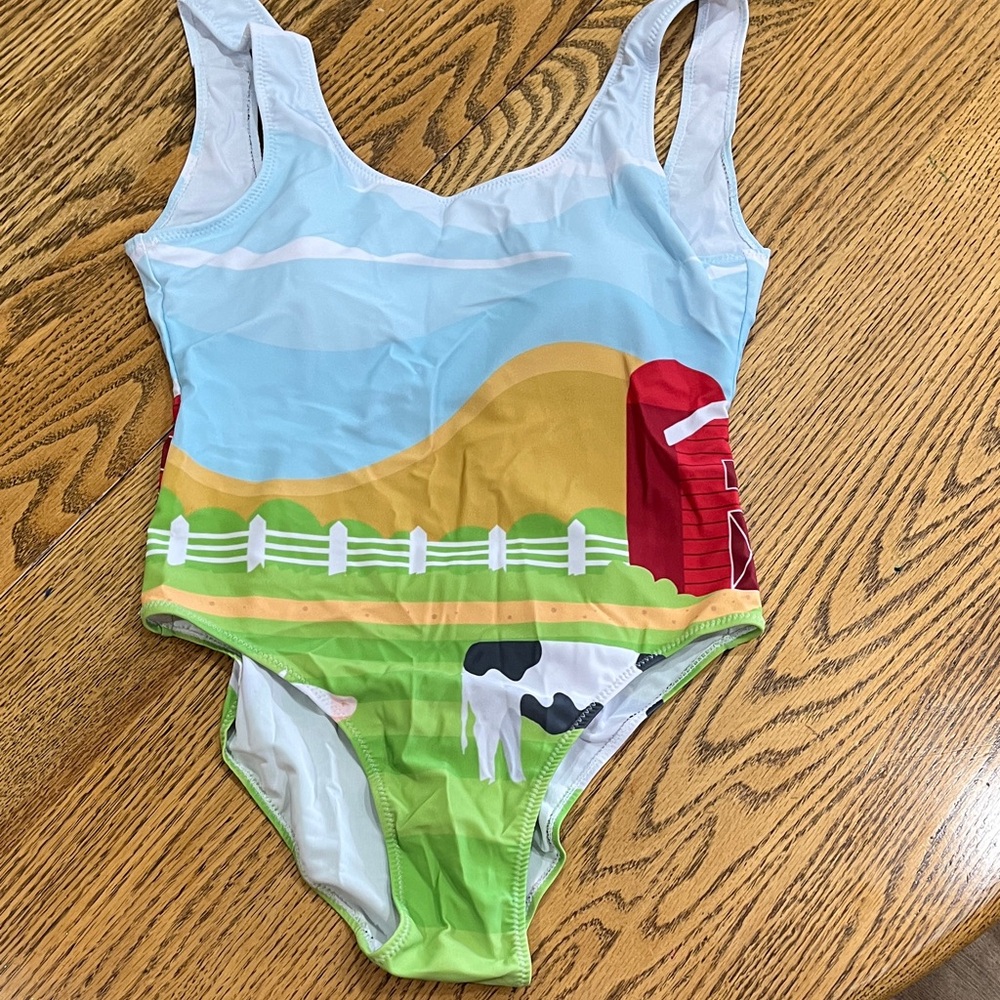 One piece swimsuit with cows and a barn S